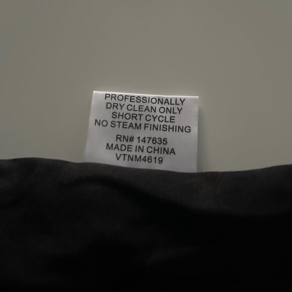 This chic mini skirt features a striking grey and black sequin pattern - Picture 10 of 11